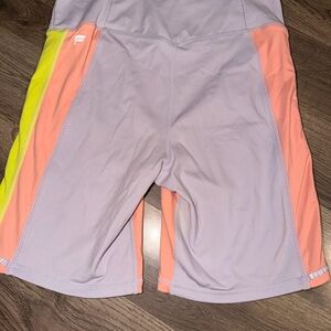 Fabletics Lavender Bike Shorts with Peach Panels and Neon Yellow Accent